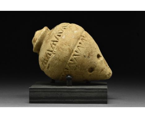 Ca. 900-1200 AD.A decorated "Greek Fire" comprising a ceramic vessel with a spheroconical body, short, squat cylindrical neck