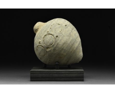 Ca. 900-1200 AD.A ceramic "Greek fire" hand grenade comprising a globular greyish vessel with a short neck, and flaring shoul