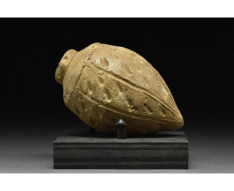 Ca. 800-1000 AD.A ceramic hand grenade, also referred to as "Greek Fire". This hollow ceramic vessel has a piriform body, wit