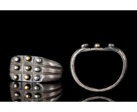 Ca. 100-200 AD.A D-shaped silver finger ring of a flat-section hoop with pair of deep grooves running through the bezel and e