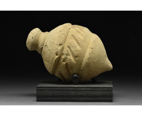 Ca. 900-1100 AD.A ceramic "Greek fire" grenade comprising a globular body with a pointed base and a domed lid. The vessel is 