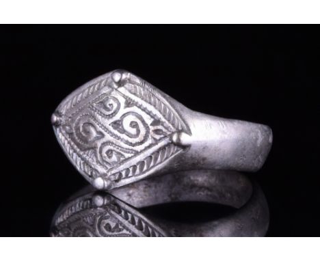 Viking Age, Ca. 900-1100 AD.A beautifully decorated silver ring comprising a circular hoop, and a lozenge-shaped bezel featur