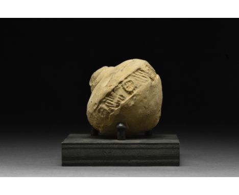 Ca. 800-1000 AD.A ceramic grenade, also referred to as "Greek Fire". This hollow vessel is acorn-shaped with a short neck and