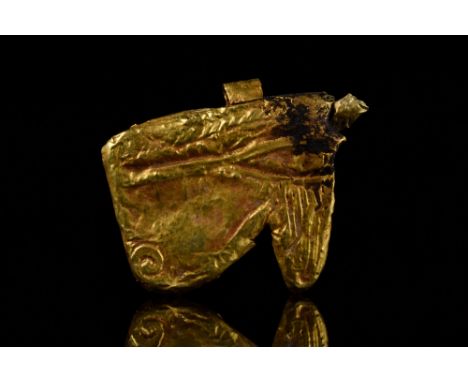 Late-Ptolemaic Periods, Ca. 663-30 BC.An Eye of Horus amulet made by wrapping a core in gold leaf, details of the eye and its