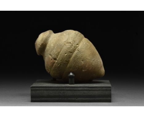 Ca. 900-1200 AD.A ceramic hand grenade composed of a globular greyish vessel with a short neck, flaring shoulders, and a poin