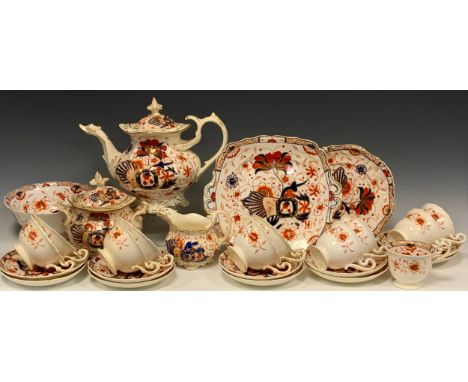 A 19th century English porcelain ‘Imari’ pattern tea service for six comprised of; a tea pot, sugar bowl, milk jug,six tea cu