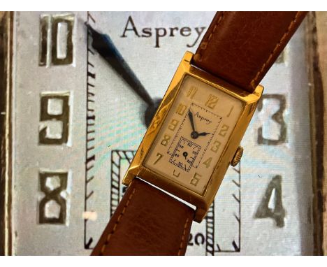 A 1920's Asprey 18ct gold tank cased wristwatch, textured silver dial, raised Arabic numerals, subsidiary seconds, blued hand