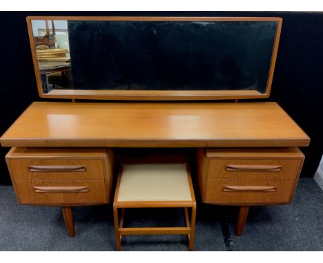A Teak G-Plan Fresco model dressing table, with stool, designed by Victor Wilkins, 1960/1970, 119.5cm high x 152.5cm wide x 4