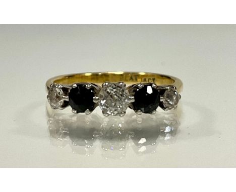 A diamond and sapphire ring, linear set with three old cut diamonds and two blue sapphires, in a tapering alternating crest, 
