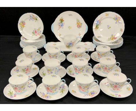 A Shelley ‘Wildflower’ pattern 13668 tea service for twelve comprised of; a picnic plate, rectangular sandwich plate, six lun