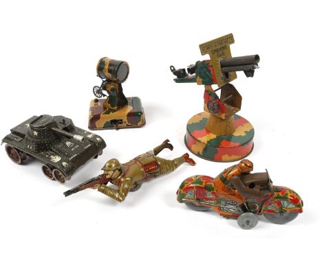 5 Military related tinplate toys. Sparking gun (made in England), on a circular base with rotate and pivot action, and firing