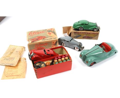 4 SCHUCO cars. Telesteering car 3000 in red, with 4 speed gears, looks complete with steering wheel, cable, wooden bollards a