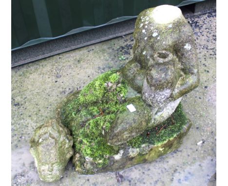 The Grange Goathland - Statue of a reclining cherub seated on a stone plinth holding a large fish under one arm (A/F), H79cm 