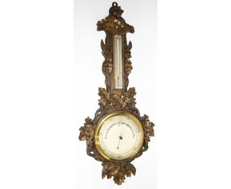 Victorian Black Forest type oak banjo aneroid barometer and thermometer, silvered circular dial with star centre, case relief
