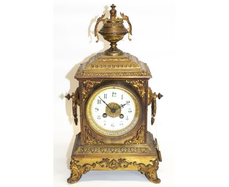 Late C19th cast gilt metal mantel clock, stepped rectangular case with urn finial on four scroll feet, cream Arabic dial and 