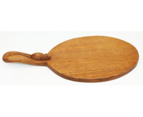 Robert Mouseman Thompson of Kilburn - an oak oval cheese board, curved handle carved with signature mouse, W30cm D18cm 