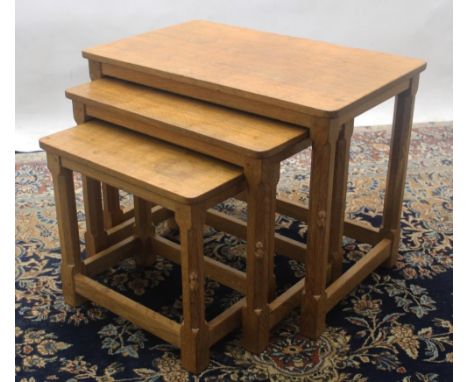 Robert Mouseman Thompson of Kilburn - a nest of three oak tables, rectangular adzed tops on octagonal and block supports join