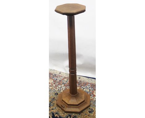 Robert Mouseman Thompson of Kilburn - an oak pedestal moulded octagonal top on similar tapering column and stepped base with 