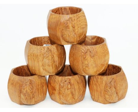 Robert Mouseman Thompson of Kilburn - a set of six oak octagonal napkin rings, carved with signature mouse, H4cm (6) 