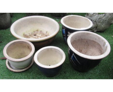 Pair of composite blue decorated floral planters, another composite planter with orange and floral decoration, and two other 