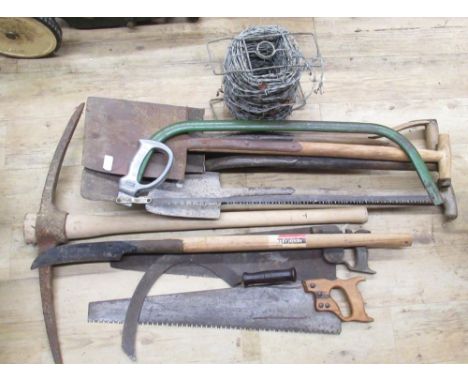 The Grange Goathland - Collection of various tools including saws, pickaxe, spades, shovels, roll of barbed wire etc 