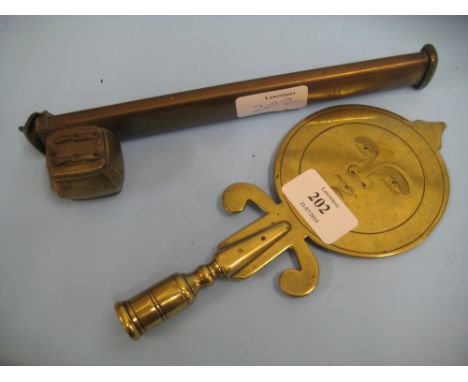 Brass staff finial engraved with a ' man in the moon ' face and a brass opium pipe