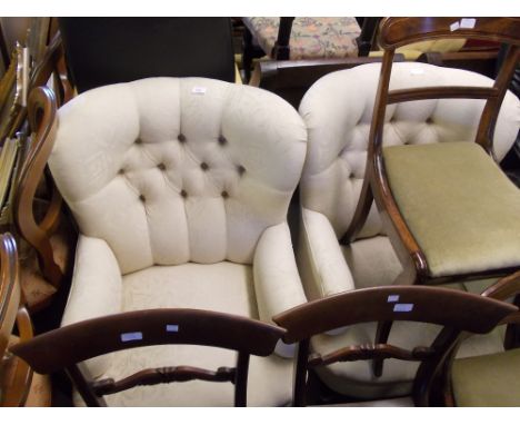 Pair of modern button upholstered tub shaped drawing room chairs covered in cream damask and raised on cabriole front support