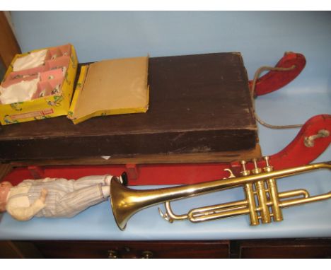 Brass Lincoln trumpet, boxed childrens teaset, Corinthian bagatelle board, 1950's doll (a/f) and a childrens sledge