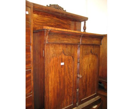 Mid 19th Century mahogany chiffonier with a low shelf back with carved crested surmount, above two shaped drawers with two pa