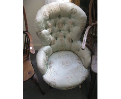 19th Century silk upholstered button back nursing chair on turned tapering front supports with ceramic and brass casters toge