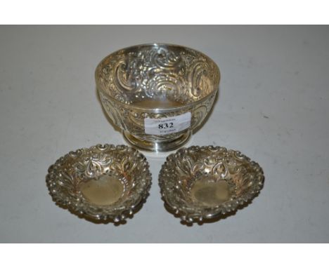 Small embossed Birmingham silver bowl and a pair of Chester silver trinket dishes