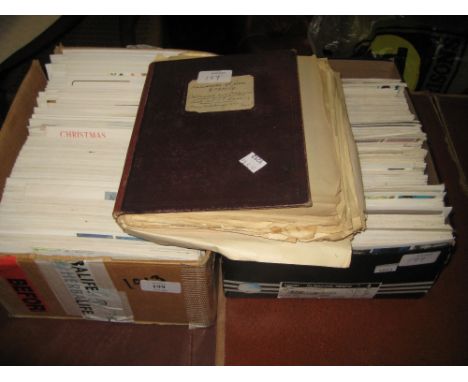 Two boxes containing a large quantity of various First Day issue stamp envelopes together with an album containing a small qu