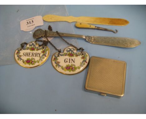 Two porcelain sherry and gin labels, a butter knife, bone paper knife and plated compact