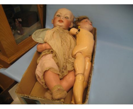 Late 19th or early 20th Century German bisque headed doll with pierced ears marked S. and C. Germany 8, on a jointed composit