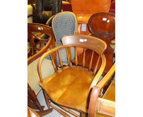 Early 20th Century oak bow back armchair on turned supports together with a 1920's walnut open armchair with blue upholstered