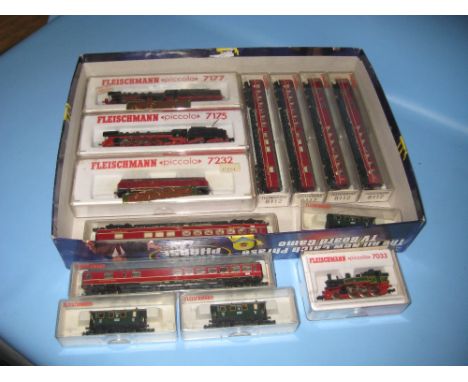 Four Fleischmann N gauge locomotives together with nine N gauge carriages, all boxed
