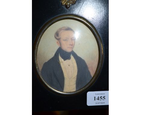 19th Century watercolour, portrait miniature of a gentleman wearing a black coat and white waistcoat, oval mounted in an ebon