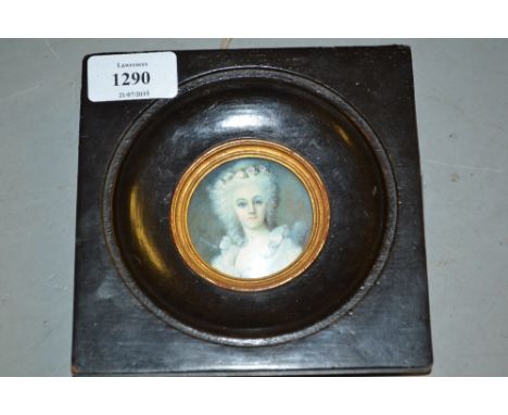 Circular mounted miniature head and shoulder portrait on ivorine of a lady, signed Pastora, ebonised frame