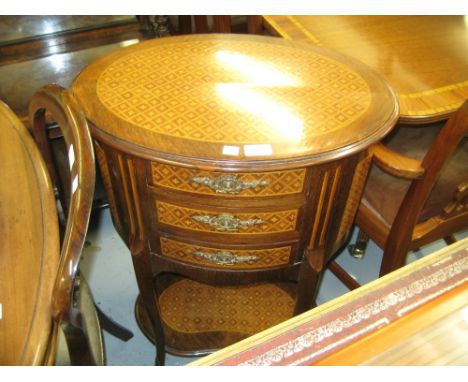 Early 20th Century French oval rosewood and parquetry inlaid three drawer commode raised on cabriole supports with undertier