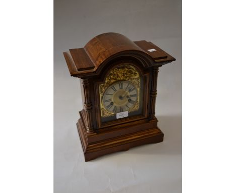 20th Century continental mahogany cased bracket clock, the brass dial with silvered chapter ring having Roman numerals striki