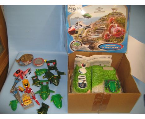 Box containing a quantity of various small Thunderbirds toys including a boxed Thunderbirds Tracy Island toy