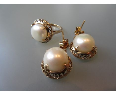 Continental 14ct gold mounted button cultured pearl ring, together with a pair of matching ear drops