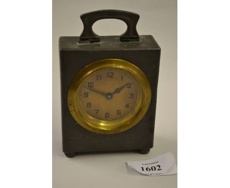 Liberty and Co. pewter cased mantel clock with folding carrying handle and circular paper dial with Arabic numerals