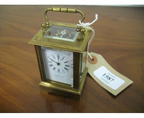 Miniature gilt brass cased carriage clock, the enamel dial with Roman numerals, signed Hopwood, Gloucester with a single trai