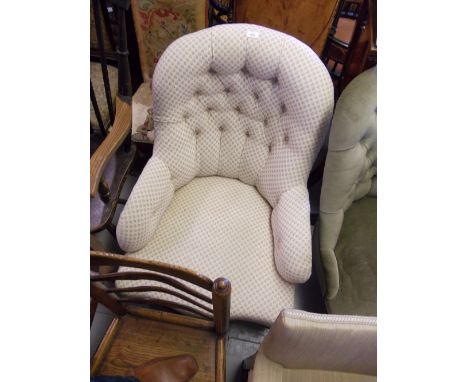 Victorian button upholstered tub shaped chair on turned supports with brass and ceramic casters