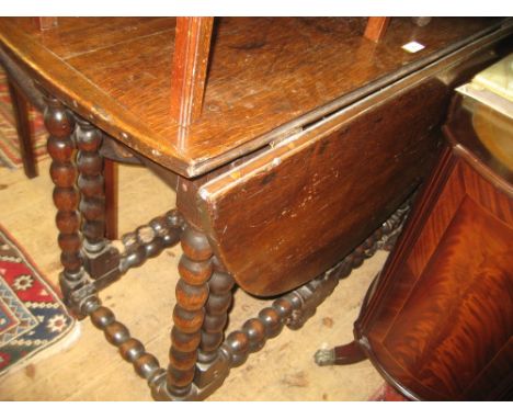 Antique oak oval drop-leaf gate leg table on bobbin turned supports (with alterations)