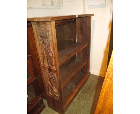 African hardwood three shelf open bookcase, the ends carved in high relief with figures