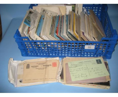 Blue tray containing a mixed collection of various postcards and First Day covers