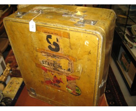 Mid 20th Century pig skin cabin trunk bearing a selection of various old luggage labels
