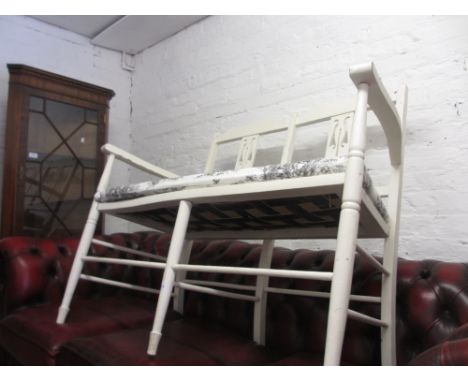 Arts and Crafts white painted two seat sofa with pierced slatted back raised on turned supports